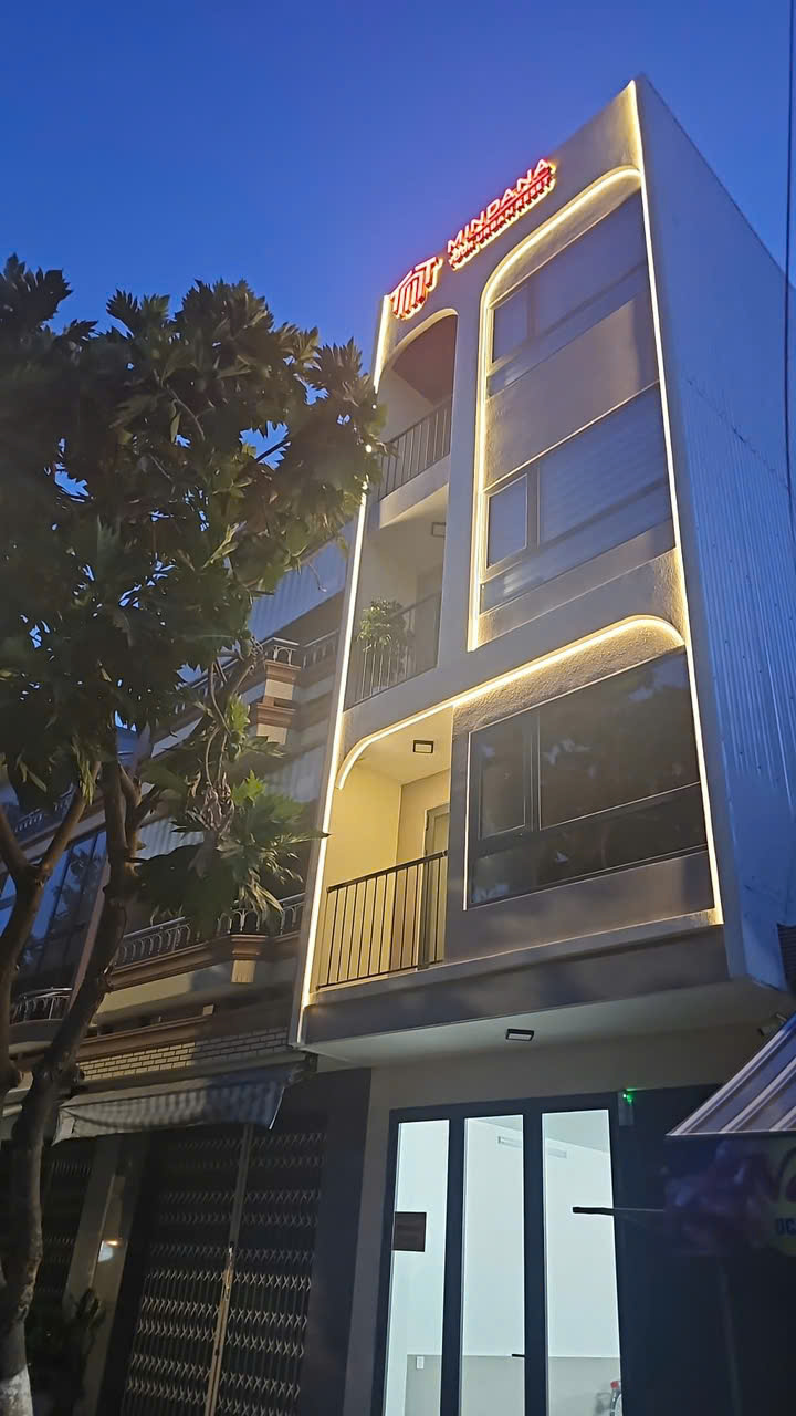Mindana Apartments exterior at night